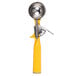 A yellow and silver Vollrath Jacob's Pride thumb press ice cream scoop.