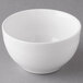 A white Libbey Aluma porcelain bouillon cup with a white rim on a gray surface.