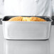 A loaf of bread in a Vollrath non-stick aluminum bread loaf pan.