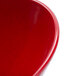 A close up of a red GET Red Sensation slanted bowl.