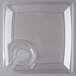 A clear plastic square plate with a circular cup holder in it.