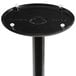 A black Lancaster Table & Seating cast iron table base with white screws on it.