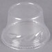 A clear plastic Fabri-Kal tall dome lid on a clear plastic cup.
