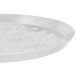 An American Metalcraft heavy weight aluminum pizza pan with nibs on a white surface.