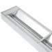 A silver rectangular metal box with a long handle containing stainless steel and white Calrod strips.