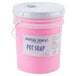 A pink container of Advantage Chemicals concentrated pot and pan soap with a white lid.
