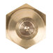 A close-up of a brass hexagonal nut on a circular metal object.
