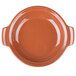 A large orange terracotta bowl with a handle.
