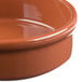 A Libbey terracotta bowl with a brown rim.