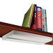 A shelf with books and a Ledu white steel under-cabinet fluorescent lamp above them.