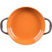 A Libbey Coos Bay pumpkin stoneware round baker with two handles in orange.