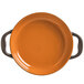 A brown Libbey Coos Bay stoneware round baker with two handles decorated with a pumpkin on a white background.