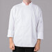 A man wearing a white Mercer Culinary chef's coat with a full mesh back.