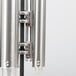 A close up of a Vollrath stainless steel cup dispenser.