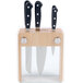 A Mercer Culinary Renaissance knife block with three knives and a knife in a wooden case.