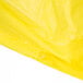 A yellow Cordova economy rain poncho in a clear plastic bag with a white background.