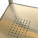 A metal surface with holes.