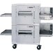 A large stainless steel Lincoln Impinger double conveyor oven with two belts.