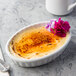 Acopa 6 oz. Oval Bright White Fluted Porcelain Souffle / Creme Brulee Dish - 36/Case Main Thumbnail 1