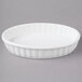 Acopa 6 oz. Oval Bright White Fluted Porcelain Souffle / Creme Brulee Dish - 36/Case Main Thumbnail 3