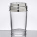 A clear glass cheese shaker with a metal lid.