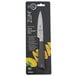 A Mercer Culinary Z&#252;M&#174; Forged Paring Knife with a black handle and yellow blade on a kitchen counter.