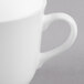 A close-up of a Reserve by Libbey bone china tea cup with a handle.