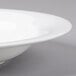 A Reserve by Libbey bone china round soup bowl with a rim.