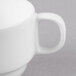 A close-up of a white Libbey Reserve bone china cup with a handle.