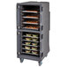 A Cambro Pro Cart Ultra food holding cabinet with trays of food inside.