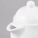 A white Reserve by Libbey bone china teapot with a lid.