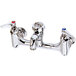 A T&S chrome wall mounted service sink faucet with lever handles.