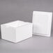A white styrofoam box with a lid.