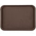 A brown rectangular Carlisle Griptite non-skid serving tray.