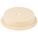 A beige plastic Cambro plate cover with a hole in the top.