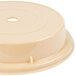 A beige plastic Cambro plate cover with a hole in the center.