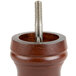 A Fletchers' Mill walnut wooden pepper grinder with a metal screw.