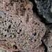 Globe CHARROCK equivalent lava rocks, a close up of a lava rock with holes.