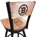A black steel bar height swivel chair with a maple seat and back engraved with the Boston Bruins logo.