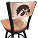 A black steel bar height swivel chair with a wooden maple back and seat engraved with the University of Iowa Hawkeyes logo.