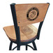 A black steel bar stool with a maple wood back and seat, laser engraved with the United States Marine Corps logo.