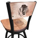 A black and white Chicago Blackhawks logo laser engraved on a maple wood bar height swivel chair.