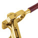 A brass-plated Franmara Bar-Pull wine opener with a red handle.