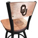 A black steel bar stool with a maple wood seat and back engraved with "University of Oklahoma" and a logo.
