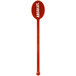 A red plastic oval stirrer with white text reading "Spirit" on the handle.