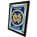 A white framed mirror with a University of Notre Dame logo.
