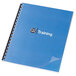 A blue and black spiral bound notebook with a clear cover.