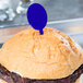 A burger with a blue WNA Comet oval pick on top.
