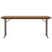A brown rectangular Correll seminar table with off-set black legs.