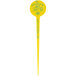 A yellow plastic disc pick with a yellow design.